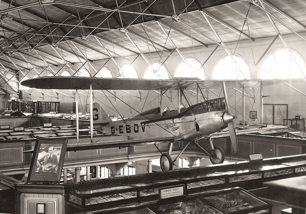 The mezzanine level of the Queensland Museum, with Bert Hinkler's Avro Avian aeroplane hanging from the roof.